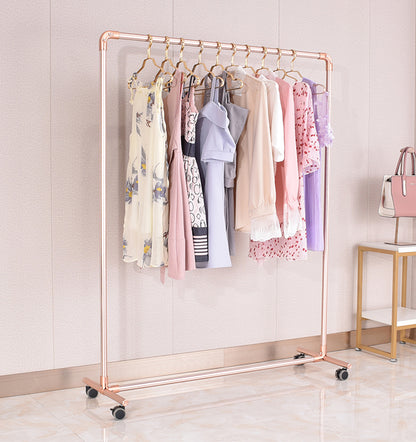 Clothing rack with clothes on wheels in a room setting