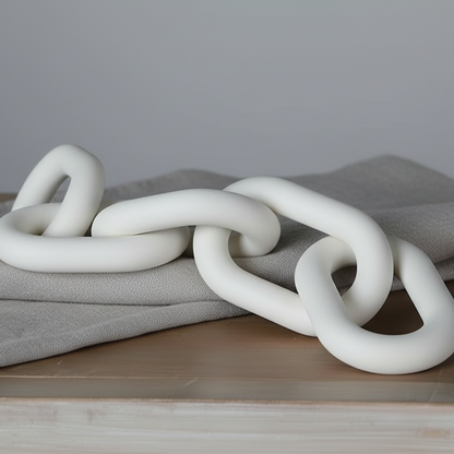 White chain on a wooden surface with a blurred background
